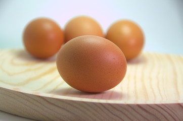 brown eggs on wooden table