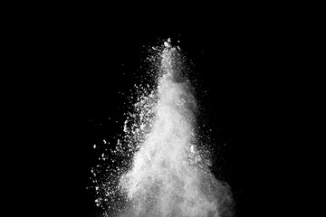 White powder explosion isolated on black background. 