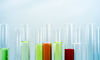 Multiple test tubes packed with chemicals, close-ups, background