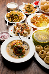 Fototapeta na wymiar group of Bombay chat food includes golgappa/panipuri, bhel-puri, sev-poori, dahipuri, Ragda pattice, raj kachori etc. selective focus