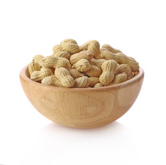 peanuts in wood bowl isolated on white background