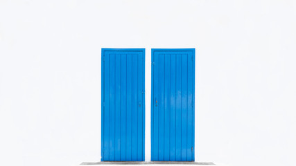 two blue doors on a white wall