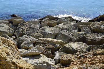 Fototapeta na wymiar Rocky coastline with a bright turquoise color of the Mediterranean Sea in Spain