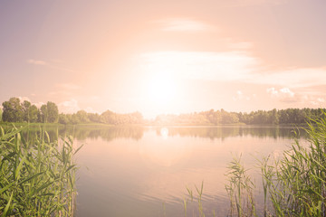 Sunset over the lake. Evening landscape.