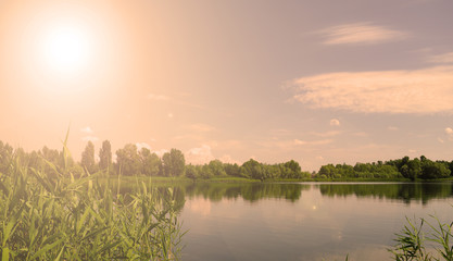 Sunset over the lake. Evening landscape.