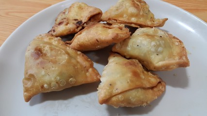 Closeup of delicious home made samosa or pastries food on white background