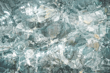 Shining blue water ripple background 