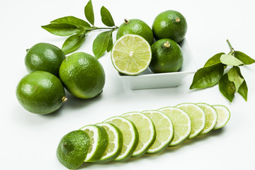 Green lemon tahiti or Citrus latifolia, isolated on  neutral background