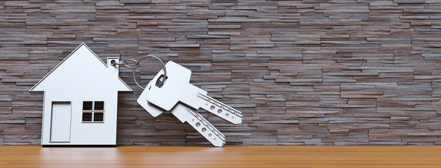 Makler Symbol mit Eigenheim am Schlüssel