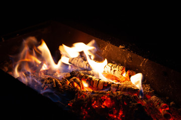 Fire bonfire. The flame of fire burns in an open furnace at night.