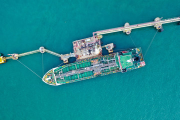 Aerial top view of the ship carrying the lpg and oil tanker in the sea port. For energy export and import business for transportation