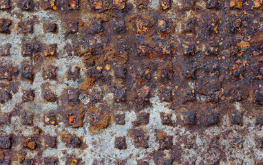 Old rusty cast-iron relief panel