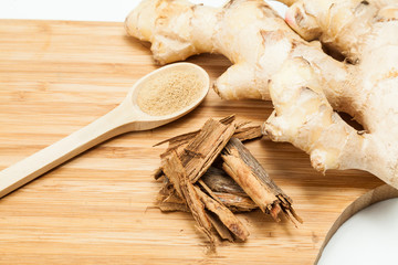 Ginger root and cinnamon ; photo on neutral background