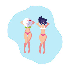 beautiful girls couple with swimsuits floating in water