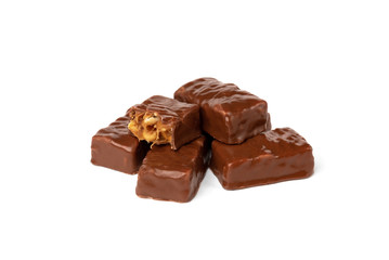 Chocolate sweet with caramel and peanut isolated on white background.