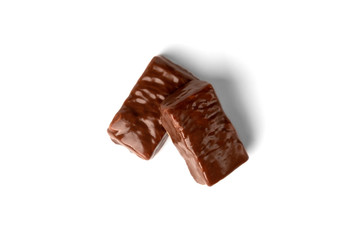 Chocolate sweet with caramel and peanut isolated on white background.