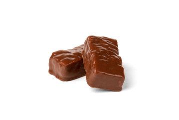 Chocolate sweet with caramel and peanut isolated on white background.