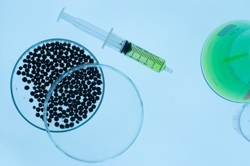Syringe containing the chemicals contained within the Erlenmeyer flask, chemical and Petri dish has...
