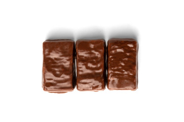 Chocolate sweet with caramel and peanut isolated on white background.