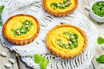 buckwheat tartlets with with white beans carrot hummus and cilantro pesto