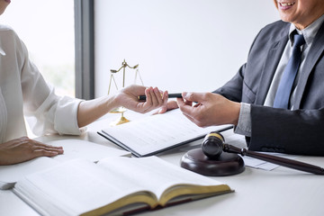 Businesswoman and Male lawyer or judge consult and conference having team meeting with client at...