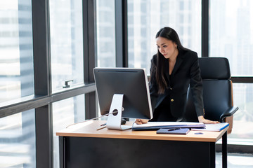 beautiful Confident asian young business woman working with computer and Calendar Planner Organization Management in modern office . entrepreneur,startup,busy,serious