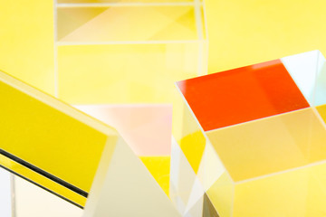 Bright glass figures in yellow light, abstraction, soft focus