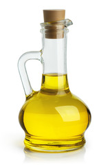 Delicious olive oil in a glass bottle, isolated on white background