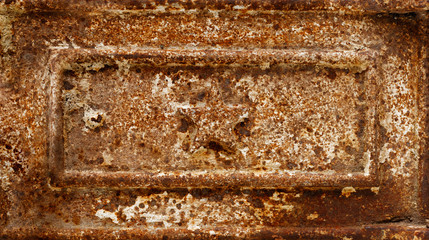 Star shape relief on rusty cast-iron panel