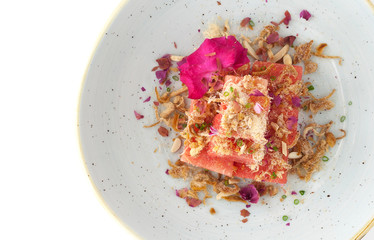 Watermelon in front of dried fish,Fried Dried Fish with Watermelon (Pla Hang Tangmo). Thai tradition dessert for summer.