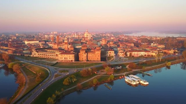 mantua skyline aerial shot drone fly forward to city center at dawn