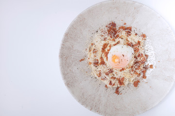 Spicy spaghetti,bacon.cheese and boiled egg on top..