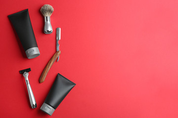 Set of shaving equipment and men's cosmetic products on color background, flat lay. Space for text