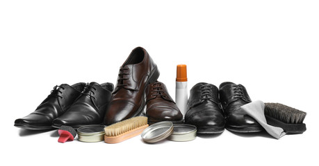 Stylish men's footwear and shoe care accessories on white background