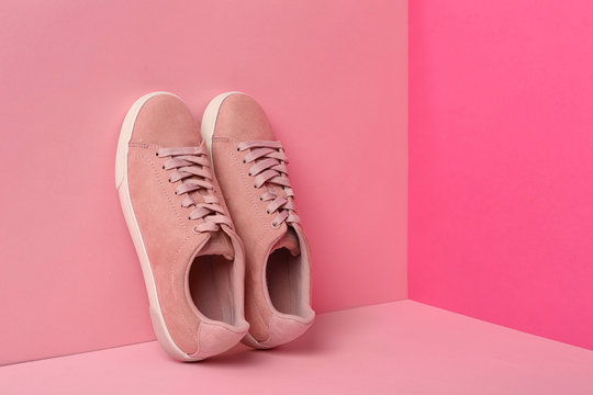 Comfortable sneakers on color background, space for text