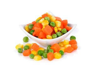 Mix of vegetable containing carrots, peas, and corn on white background