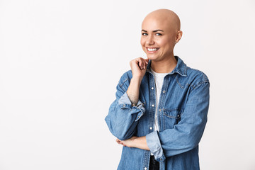 Happy bald woman posing isolated over white wall background.