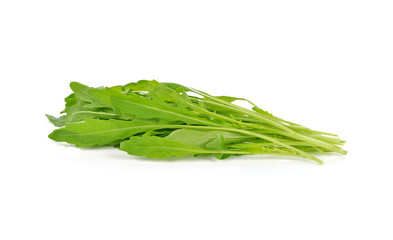 Sweet rucola salad or rocket lettuce leaves isolated on white background