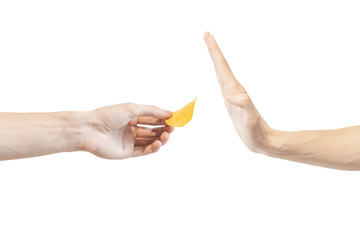 Say no potato chips. Man says no to potato chips. Hand gesture to reject proposal potato chips. Arm...