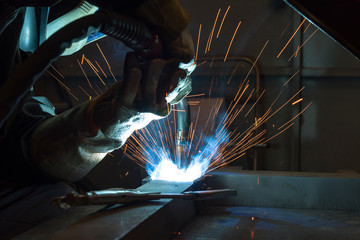 Industrial steel welder in factory welder, craftsman