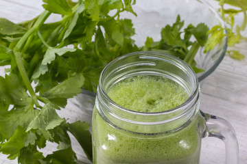 close up of fresh green celery juice on glass