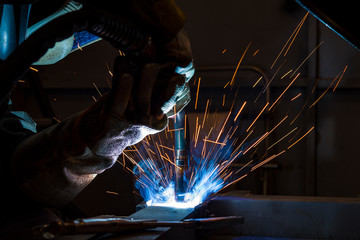 Industrial steel welder in factory welder, craftsman