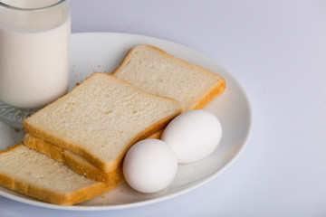 Fototapeta na wymiar closeup bread slice milk glass in plate