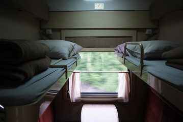 View of sleeping places in a compartment car. Details and close-up.