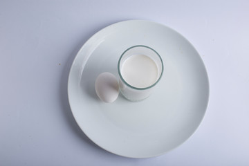 closeup milk egg in plate