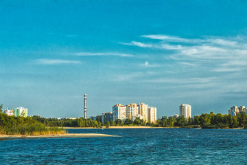 Cityscapes and skyline in clear blue sky on view from river