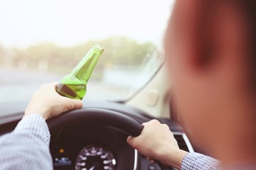  Men are drinking beer with alcohol while driving
