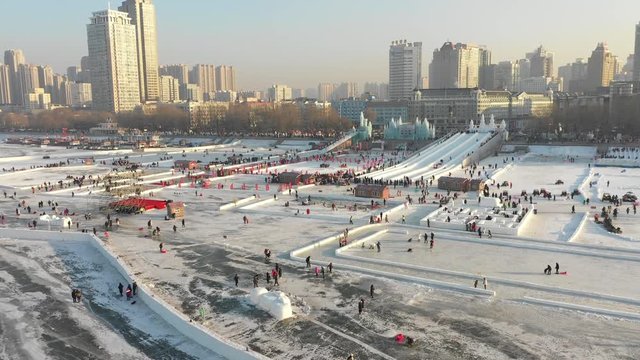 Aerial view of Winter entertainment on frozen Songhua river during annual Harbin ice and snow festival in Northern China