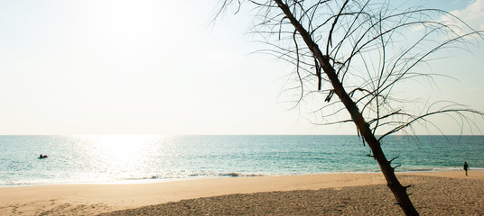 Tourists sunbathing on the beach on sunny summer.