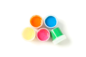 Color gouache paint cans isolated on white background, top view